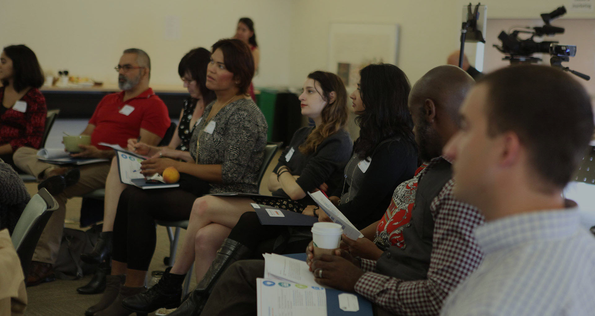 Workshop participants engaged and looking at the speaker.