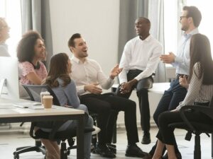 Group of employees gathered around their manager